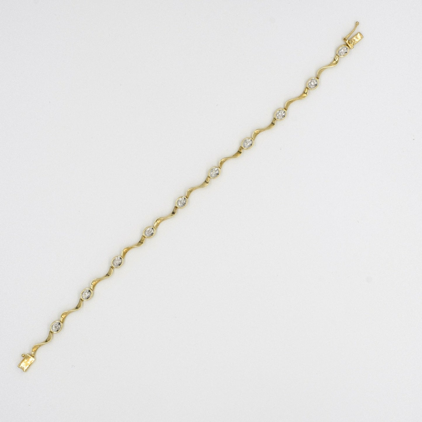 9ct yellow gold twisted 'wave' link diamond set bracelet