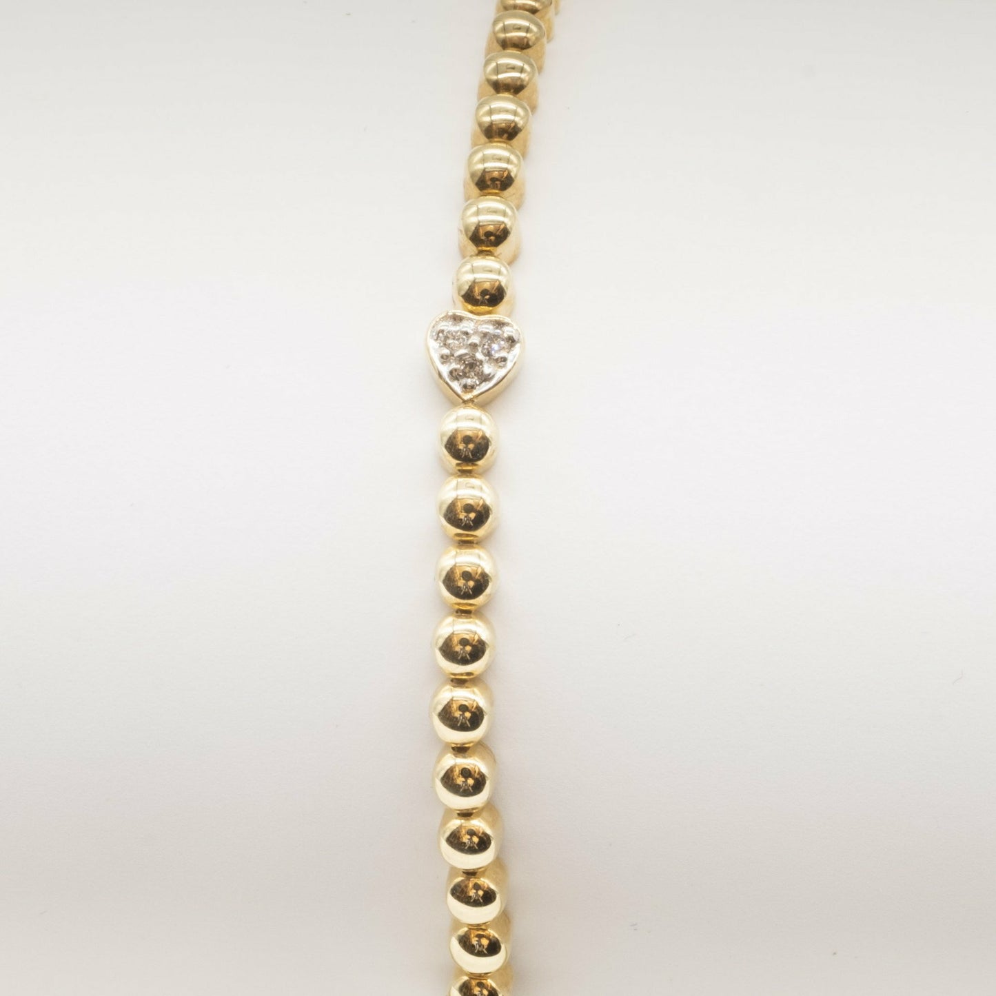 9ct yellow gold bead and white gold diamond set heart design bracelet