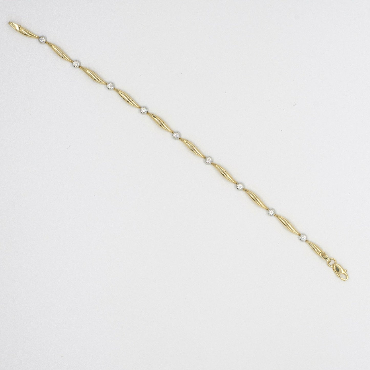 9ct yellow gold petal shaped link bracelet set with CZs
