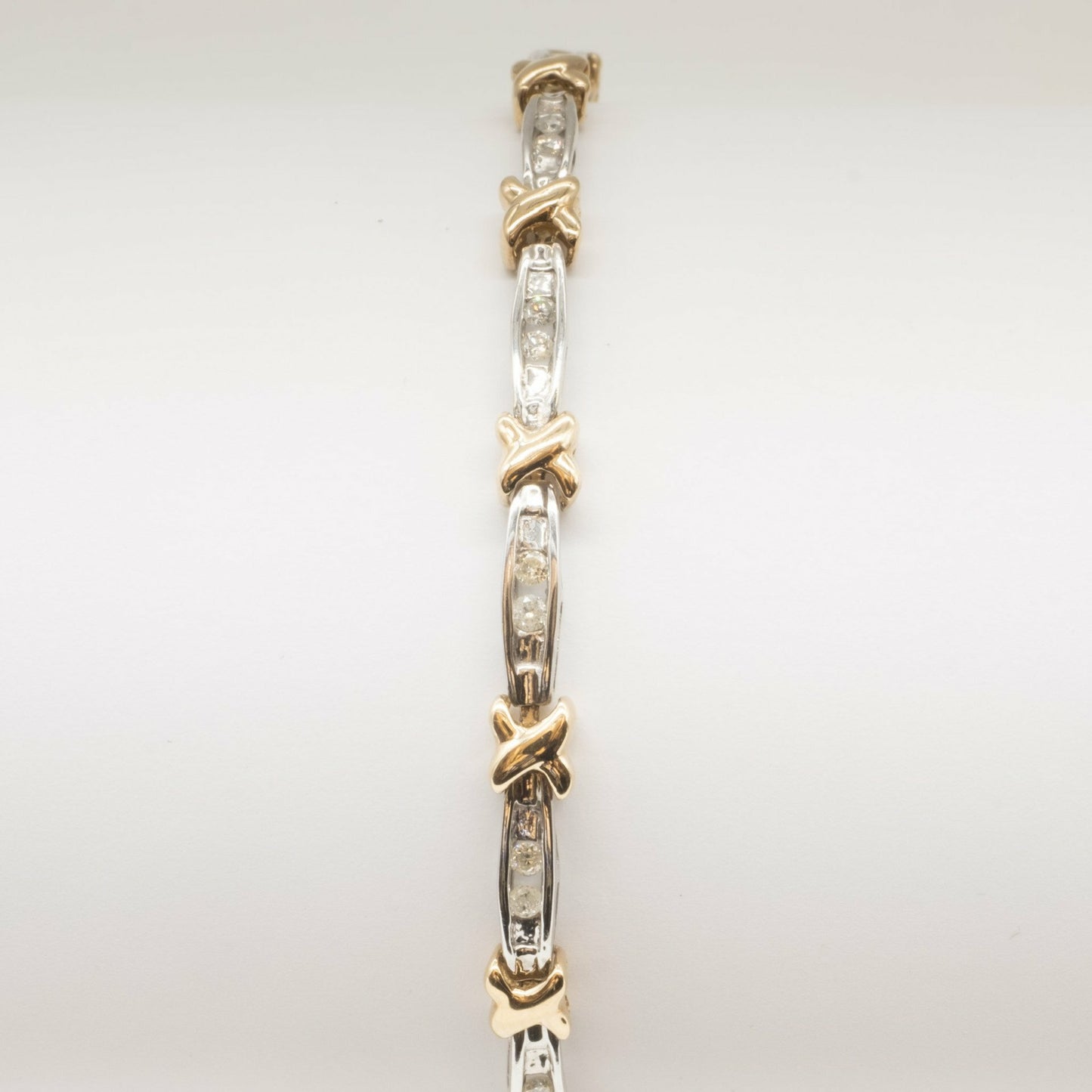 9ct yellow & white gold diamond 'kiss' design bracelet