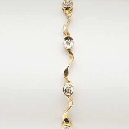 9ct yellow gold twisted 'wave' link diamond set bracelet